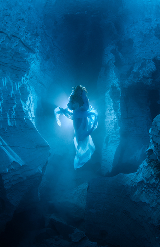 Illustration for article titled Ethereal photos of the spirit that haunts Russia's underwater crystal cave